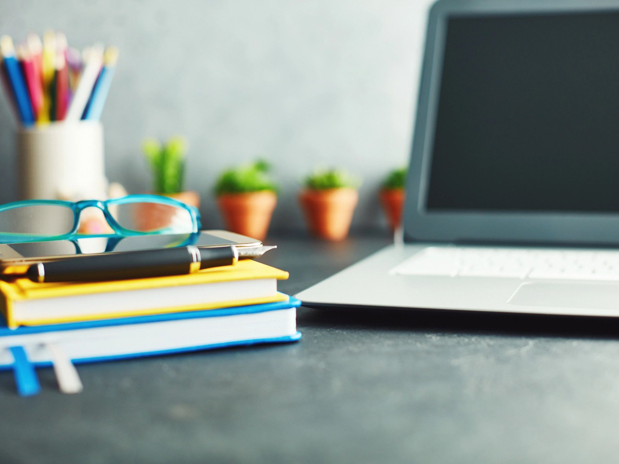 Creative desk with notebooks and accessories