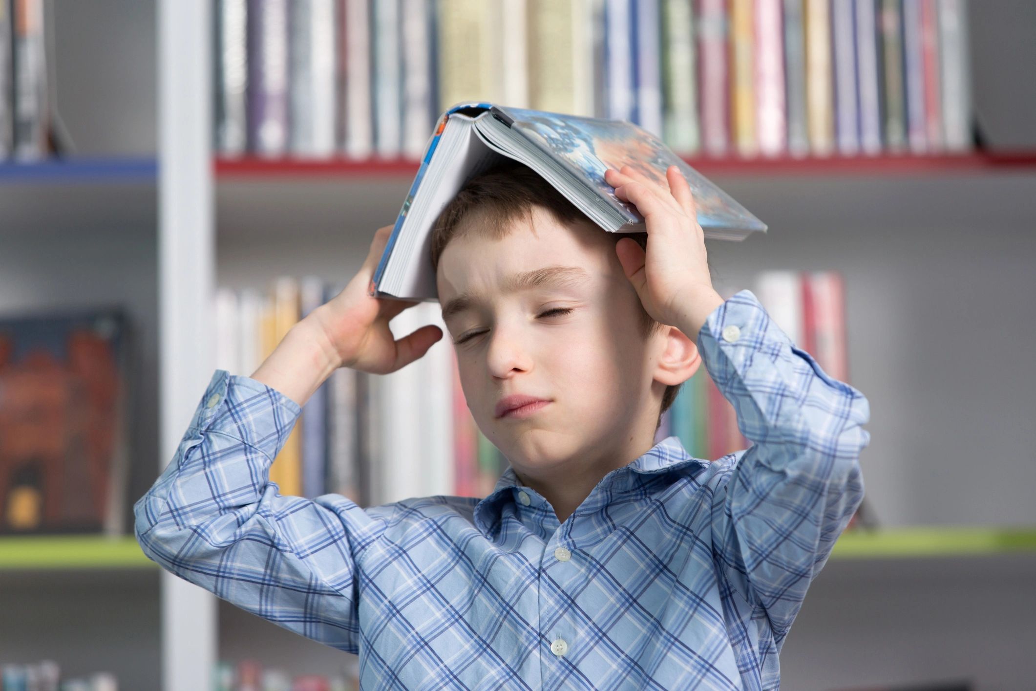 Child reading in a library