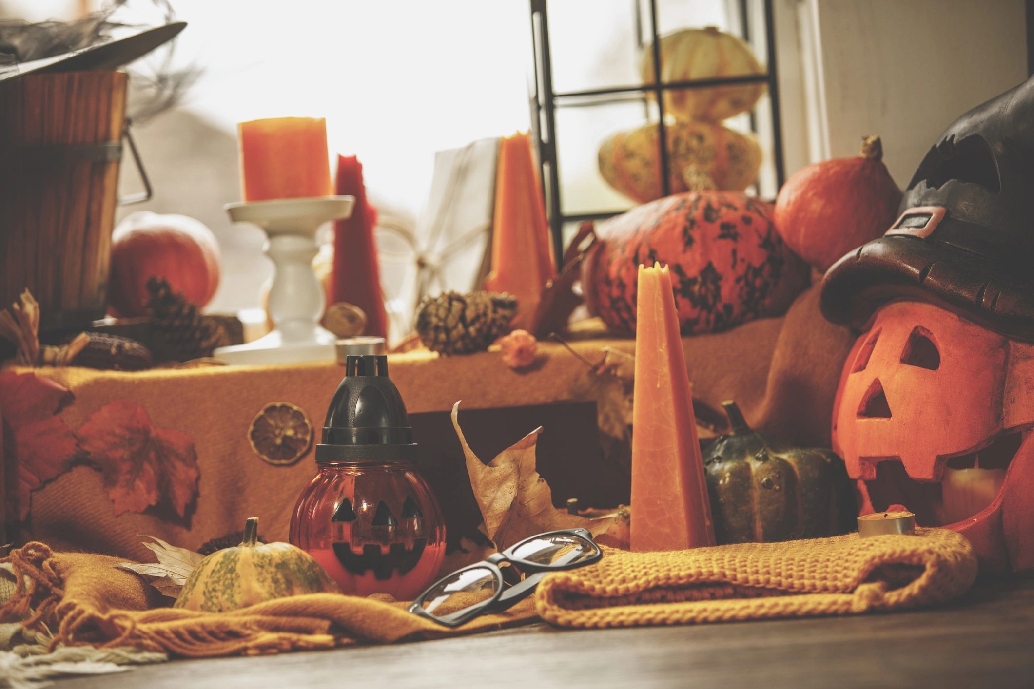 Warm candlelit corner with autumn decor for cozy setting inspiration