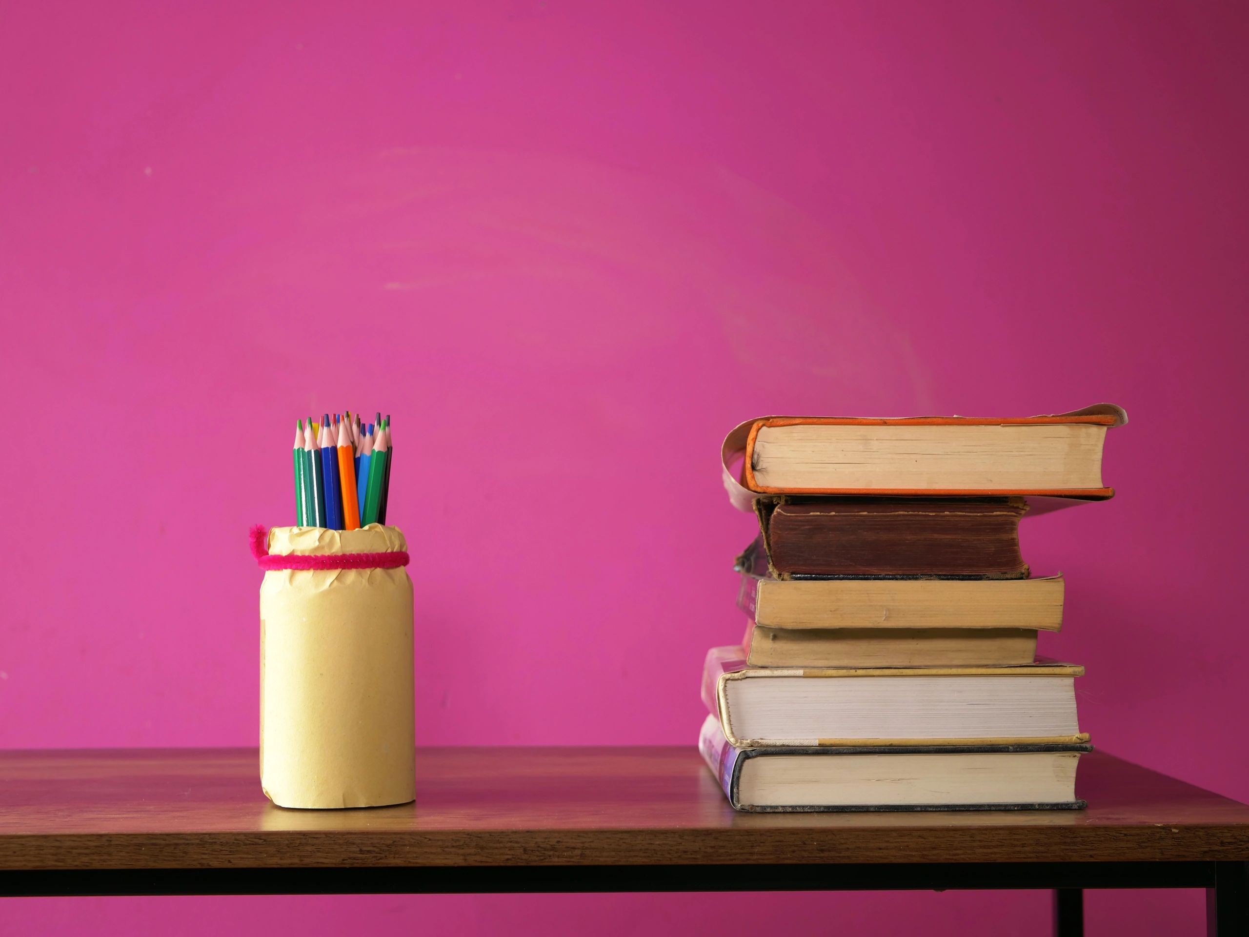 Books and pencils arranged on a writing desk