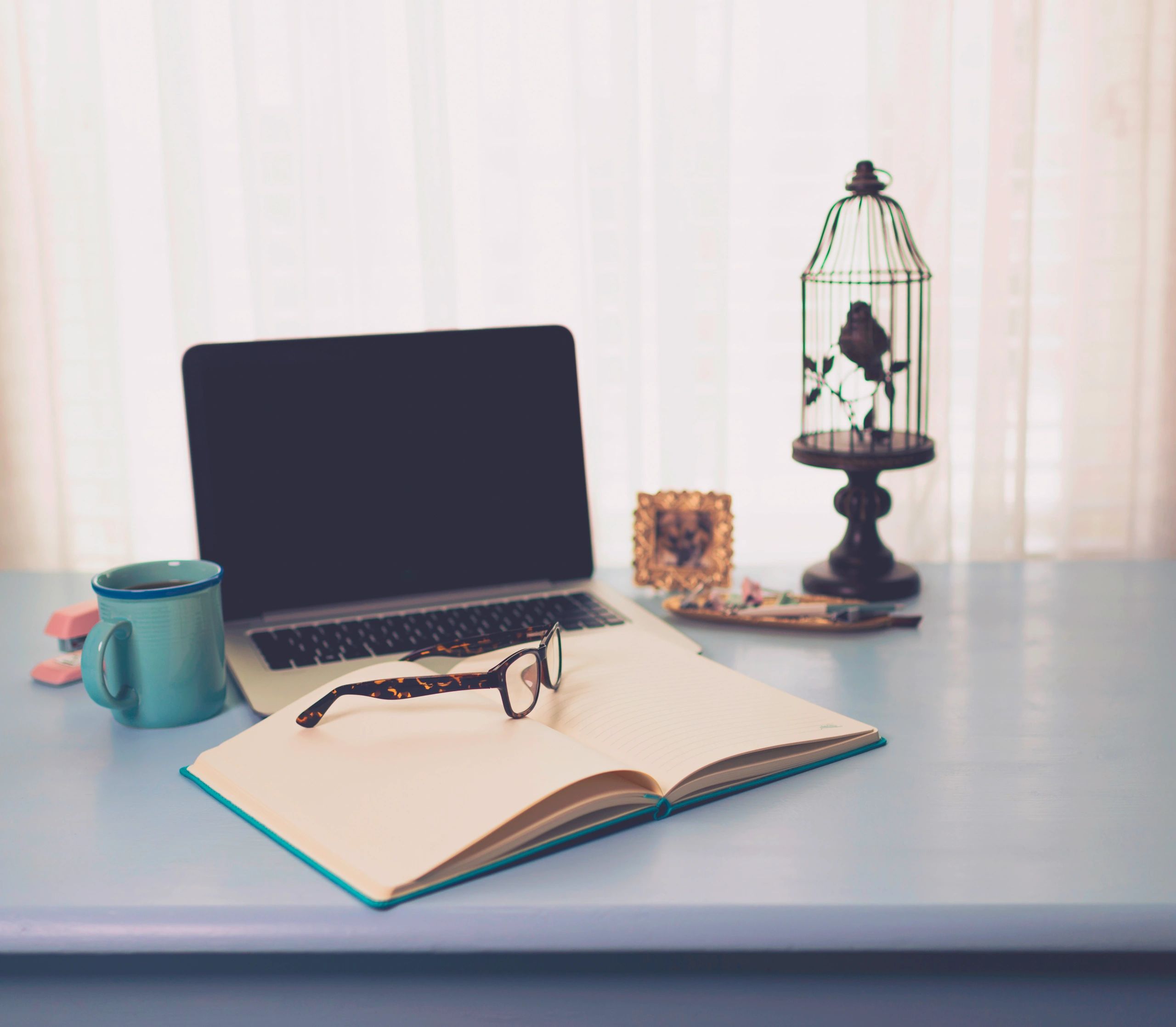 Writing desk with notebook and laptop for study planning