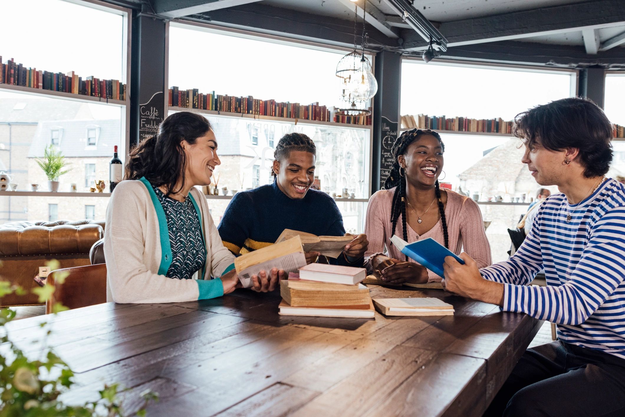Writers gathered around a table for a warm, bookish community event