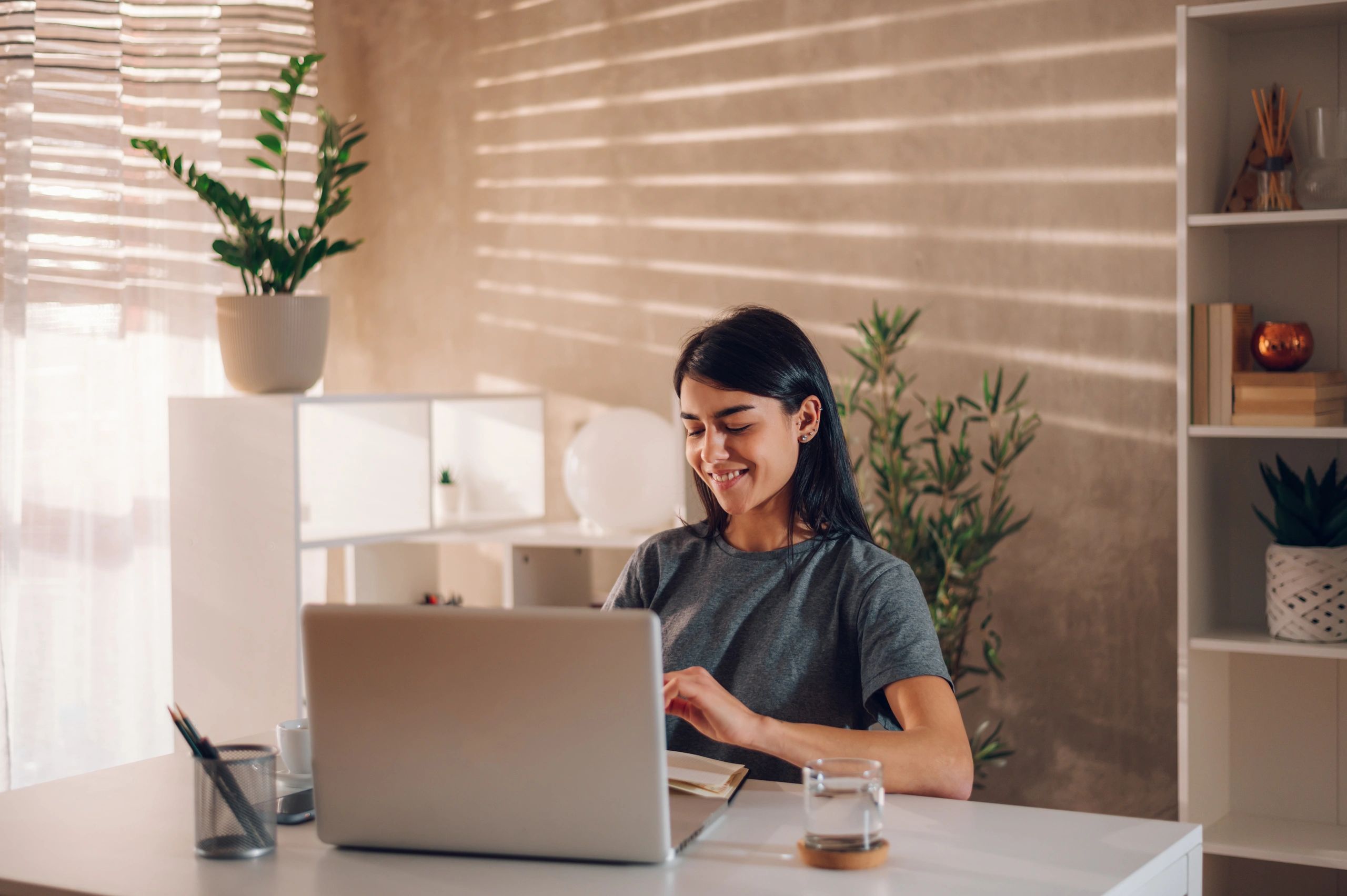 Writer smiling while working from a home office