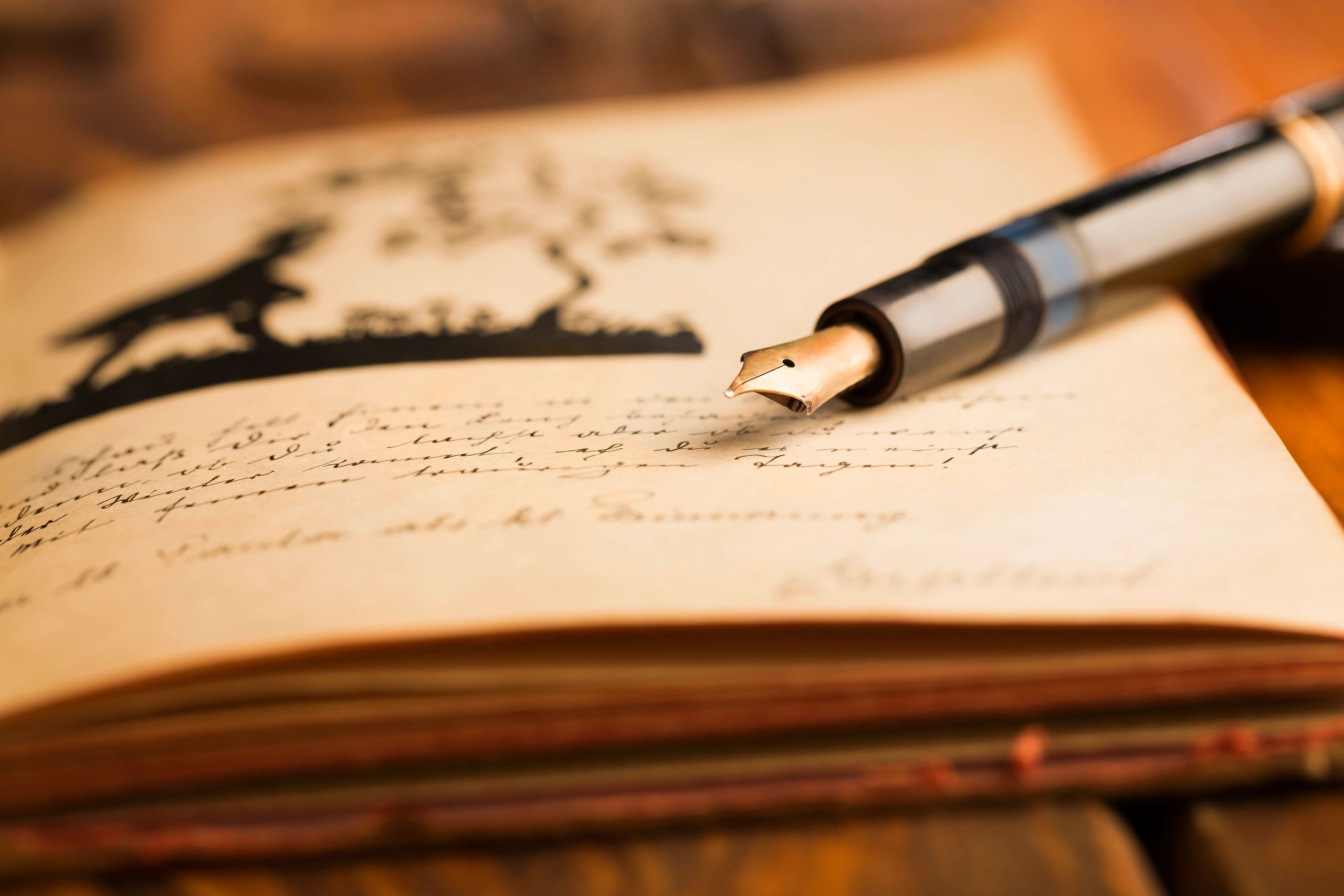 Vintage fountain pen on an old notepad