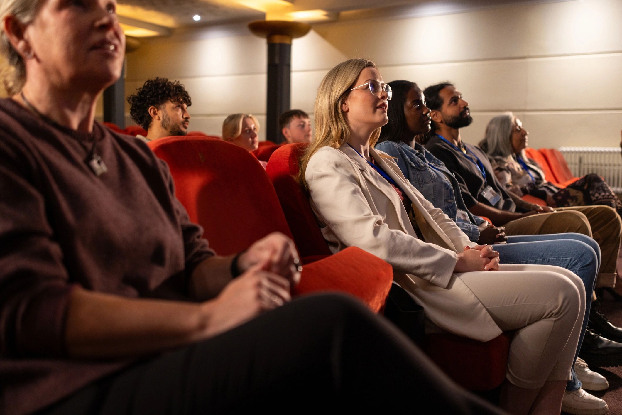 Audience attending a live author-style event or webinar session