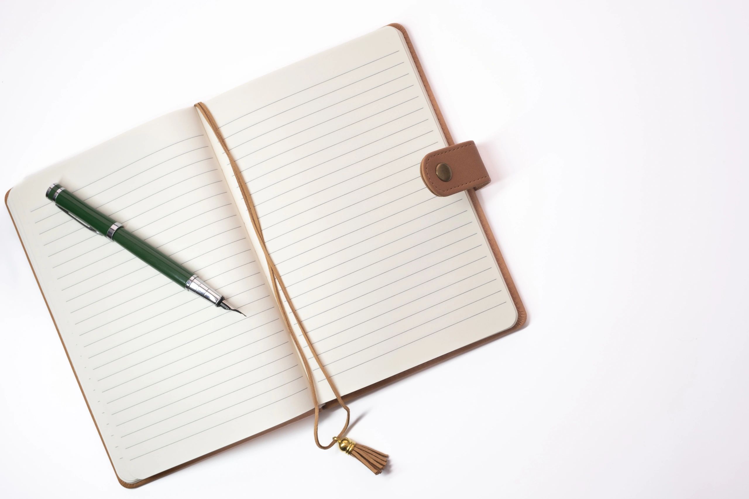 Open journal and pen for character and voice development